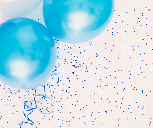Studio shot of balloons on colored spott