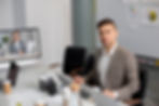 A relaxed adjuster confidently managing tasks with a virtual assistant on the other.