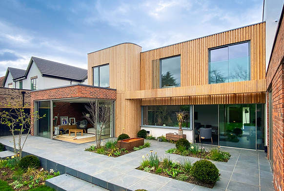 Modern home with timber cladding and patio garden
