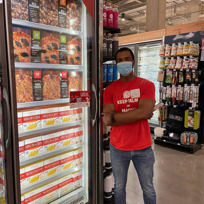Myles Powell, owner of 8 Myles with his mac n cheese in Whole Foods