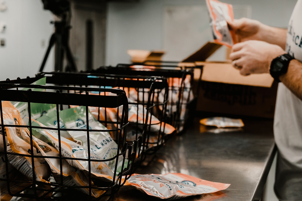 packages from Backattack Snacks in Cleveland get packaged