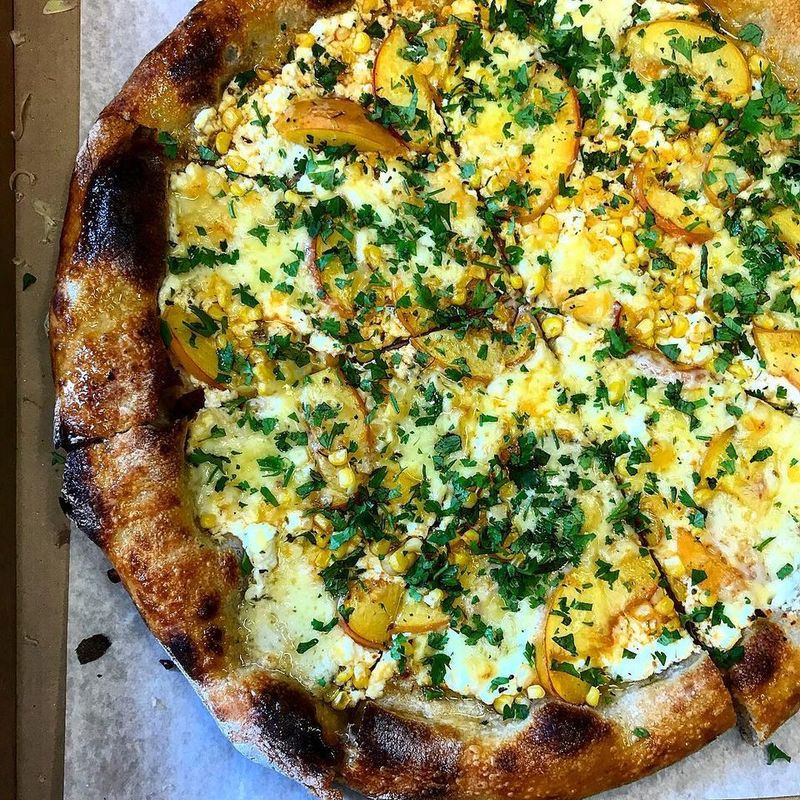 a pizza from Driftwood Oven