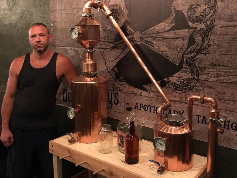 Mike, co-owner of Inspired by Spirits distillery in Pittsburgh, next to one of the stills he designed himself.