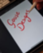 an apple pen writes Goose Designs on an Ipad in red