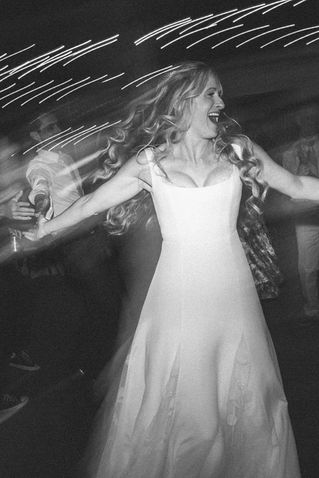 Photo by Ali Vagnini Photography at Paddle Ridge in West Glacier Montana - Bride spins circles on the dance floor with light trails behind her
- Sidecar Audio