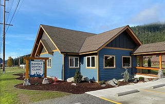 exterior shot of commercial building with blue siding and light tan trim