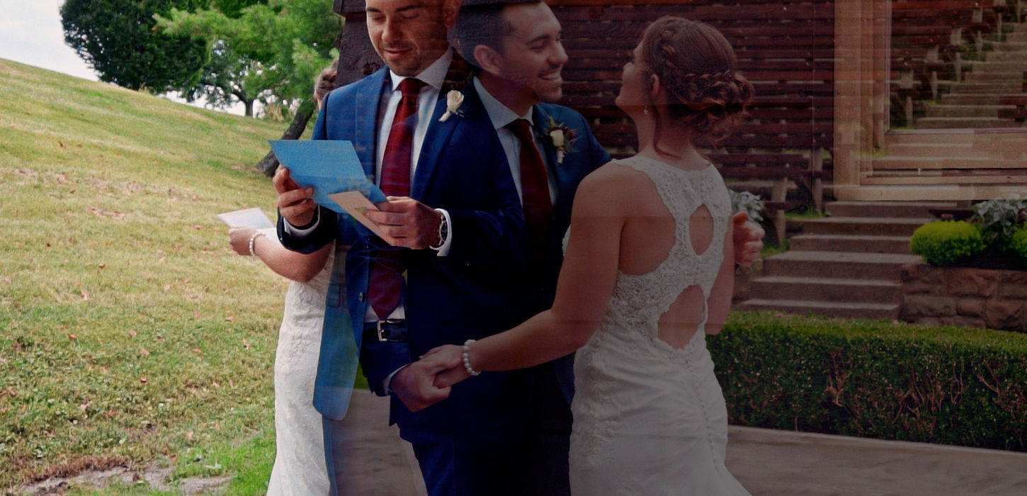 Zac and Emily face each other outdoors while their officiant reads beside them.