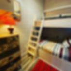 bedroom with custom built-in bunk bed; full on bottom and twin on top
