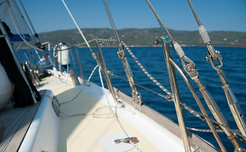 Sailor practicing seamanship on a luxury yacht, representing premium sailing training at Zeeland academy
