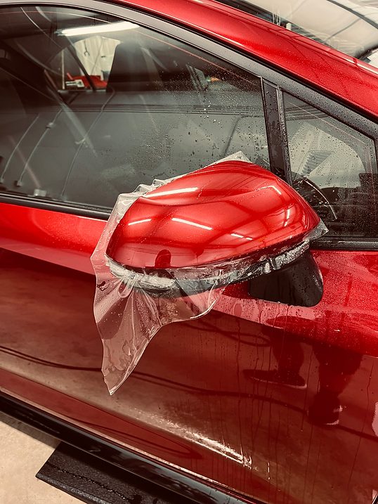 red car mirror ppf.heic