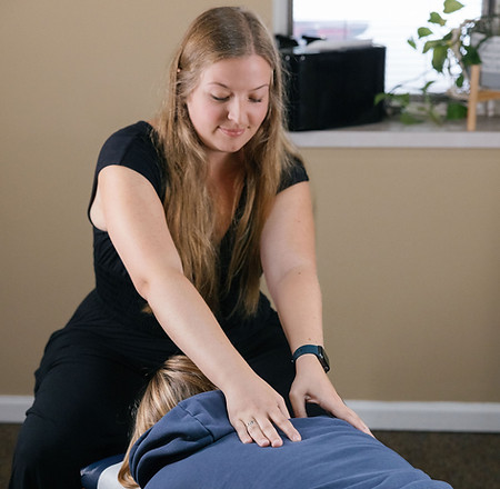 Patient receiving gentle chiropractic adjustment for improved mobility and lasting pain relief