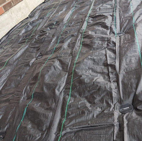 Weed protection for outdoor backyard deck Deck building work in progress Beautiful large new deck made from pressure treated lumber summer bbq bakyard pine trees modern backyard vinyl fence decowalls.ca