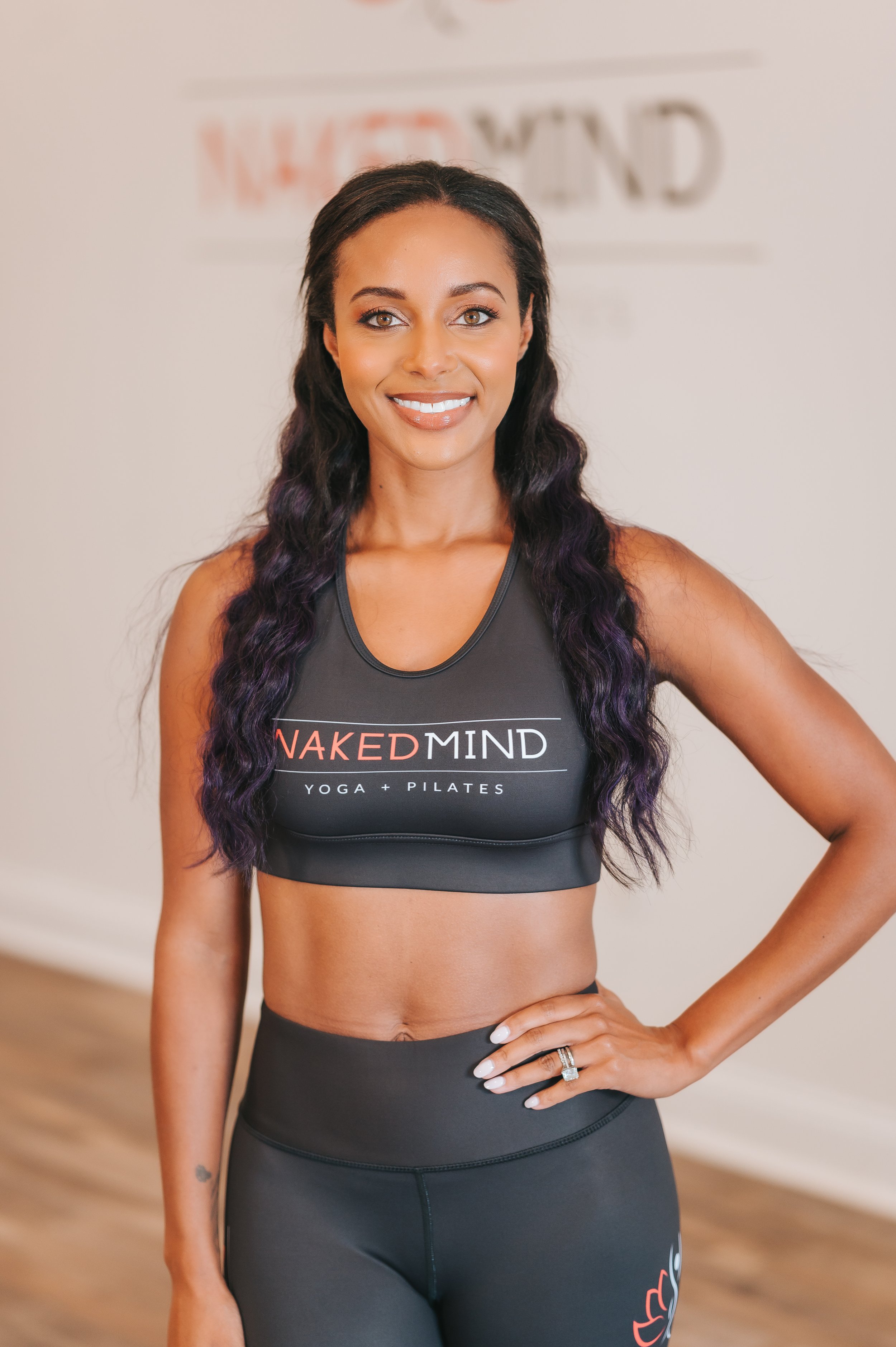 Headshot of owner Brandi in black activewear at Naked Mind Studio Roswell Atlanta.