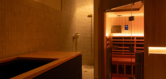 Warm cedar interior of private infrared sauna at Pause East Cobb Atlanta wellness center.