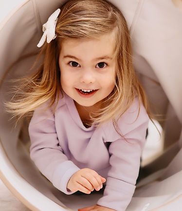 Girl crawling in tube