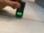 A moisture sensor being used to test moisture levels between two tiles in a kitchen indoors in Cape Town