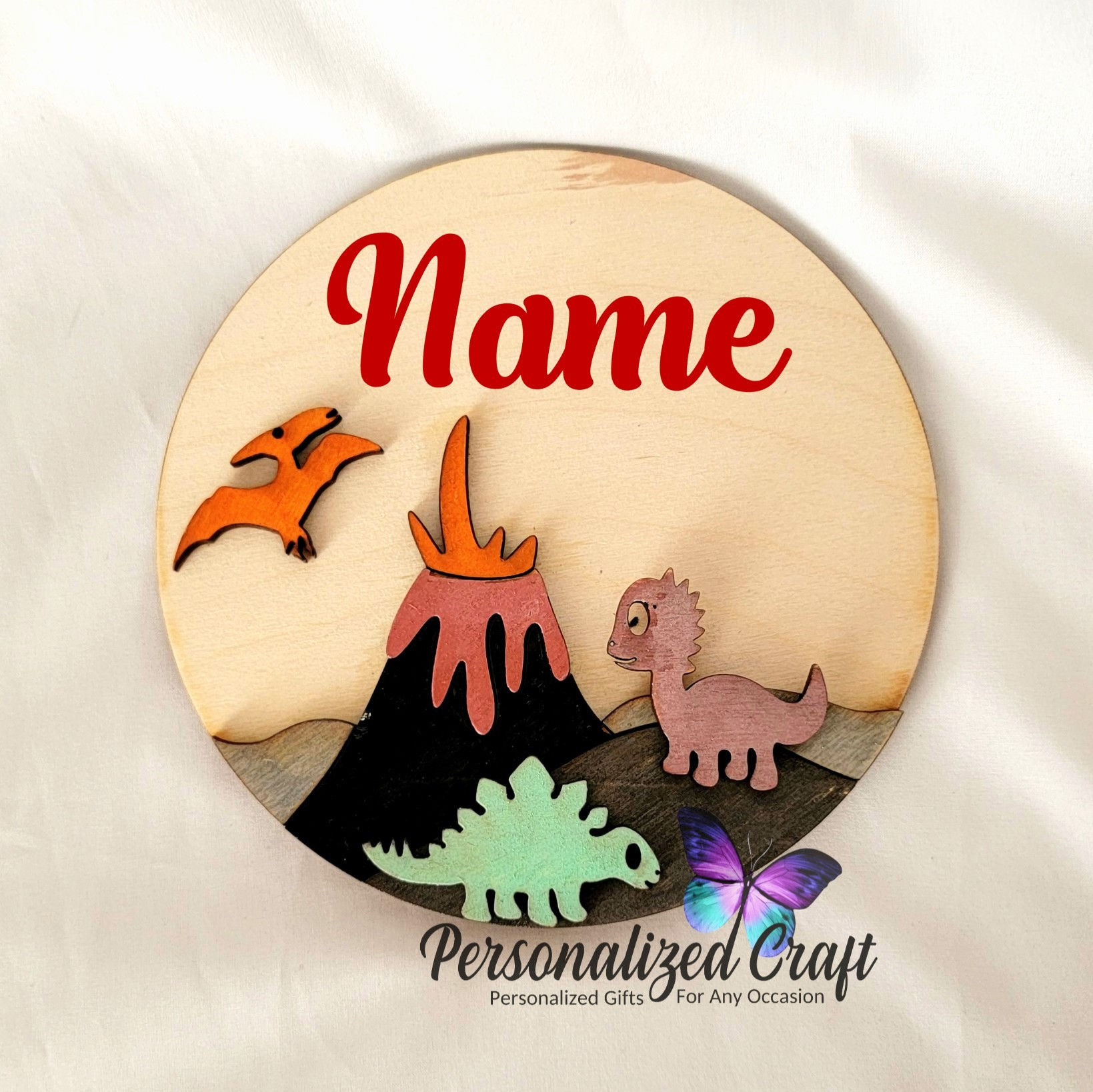 Round wood nursery wall decor with dinosaurs and volcano