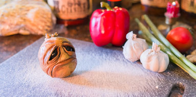 Spoiled potato crying on a kitchen cutting board