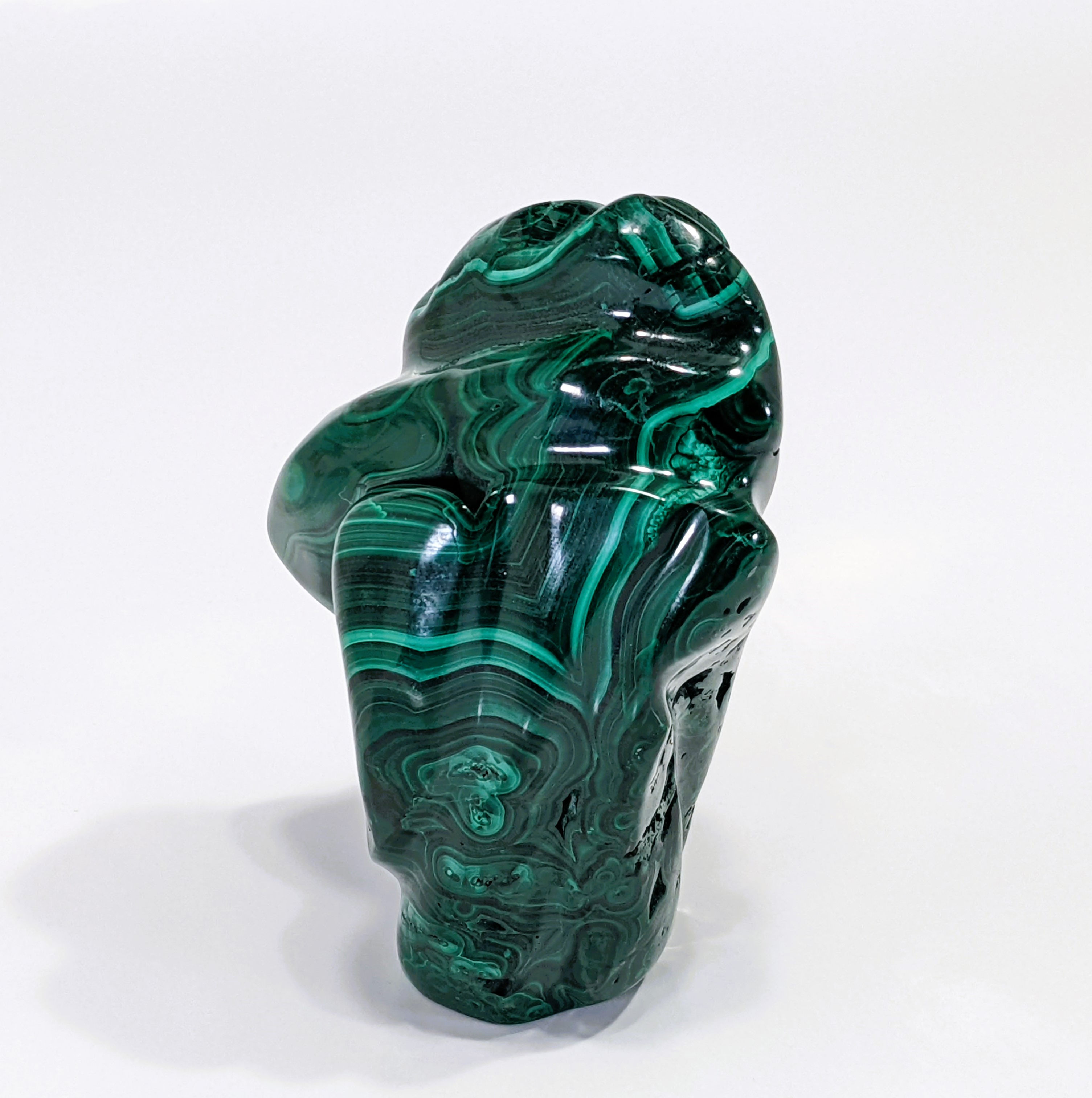 Polished Malachite showcasing vibrant green swirls and natural banding patterns