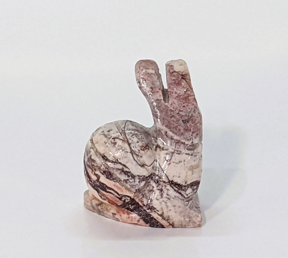 Thumbnail: Miniature soapstone snail carving, symbolizing patience, flow, and mindful movement.
