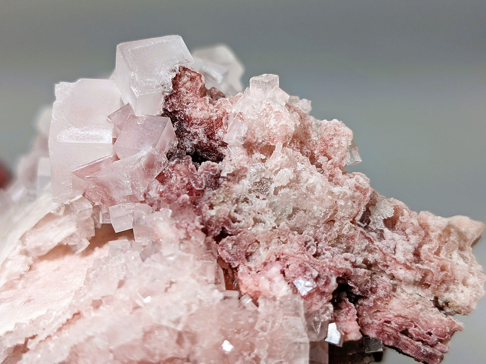 natural pink halite crystal with soft color and cubic structure