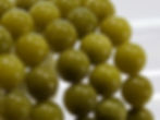 Serpentine beaded bracelet with smooth green stones featuring subtle darker veins, offering a natural, earthy look.