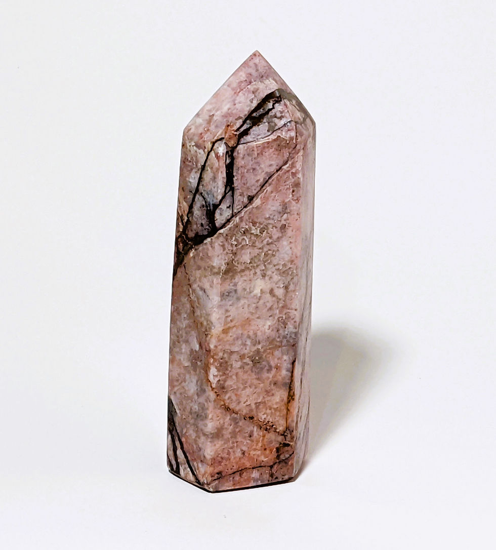 Thumbnail: Rhodonite tower with pink and black veining for grounding and emotional healing.