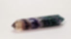 Double terminated Rainbow Fluorite crystal point with natural purple, green, and blue layers.