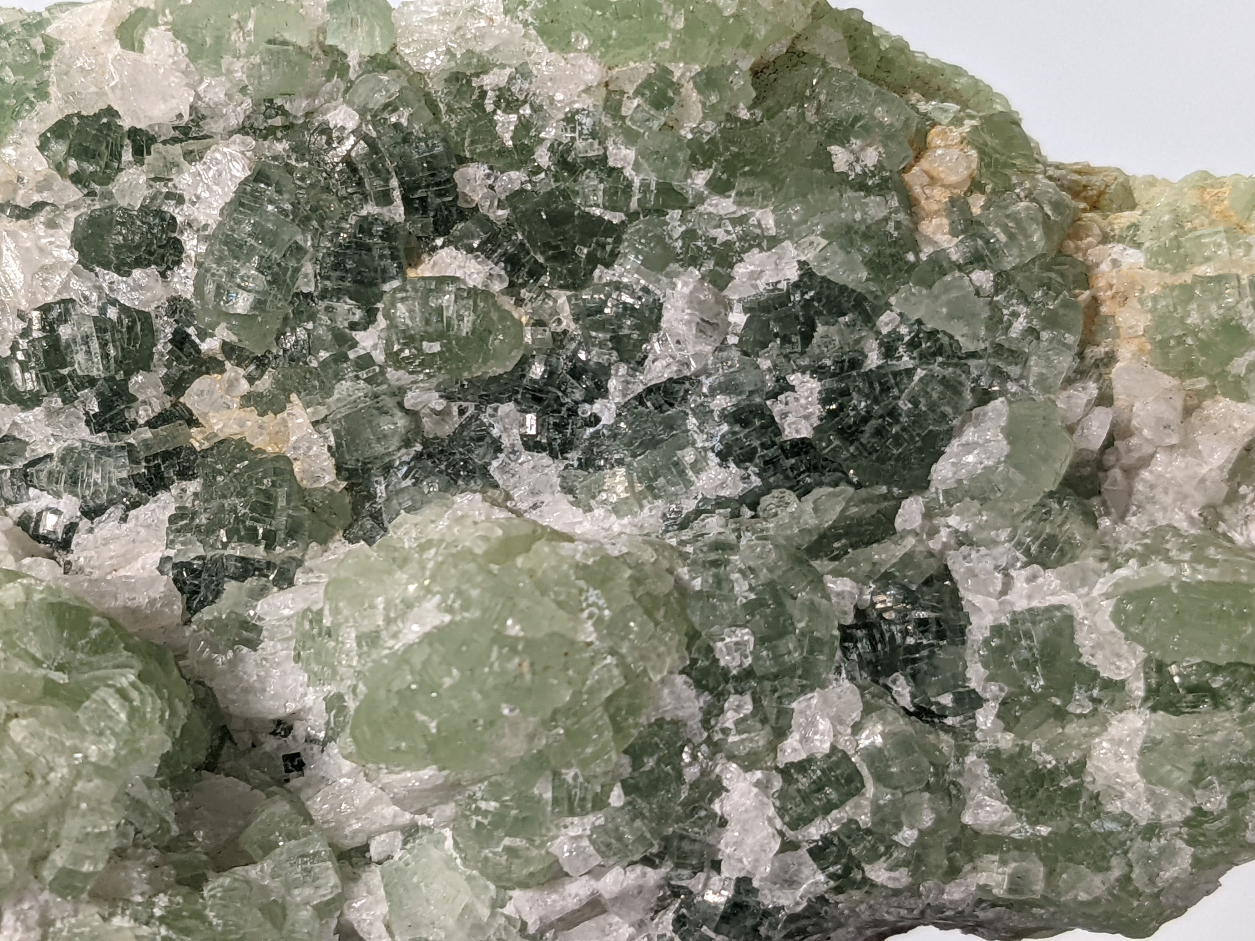 Rough Prehnite specimen with translucent green crystal formations