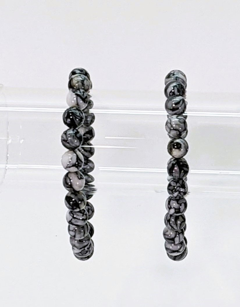 Thumbnail: _black-and-white_black-needle-like-crystals_jujujems_metaphysical_peace_mineral-collector_unique_magnesite_dolomite_pinolith