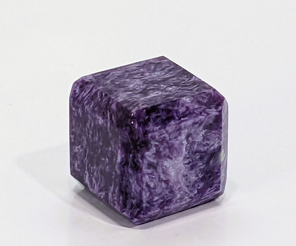 Thumbnail: Charoite cube featuring smooth, purple swirling patterns with natural inclusions.