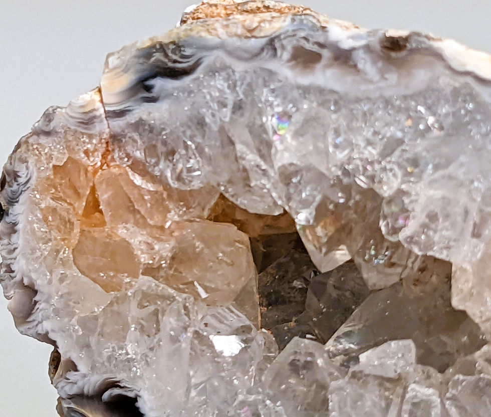 Thumbnail: Half Oco Agate geode showing sparkling inner crystals and banded agate from Brazil.