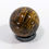 Thumbnail: Polished Tiger Iron sphere showing layered earthy tones and metallic highlights.