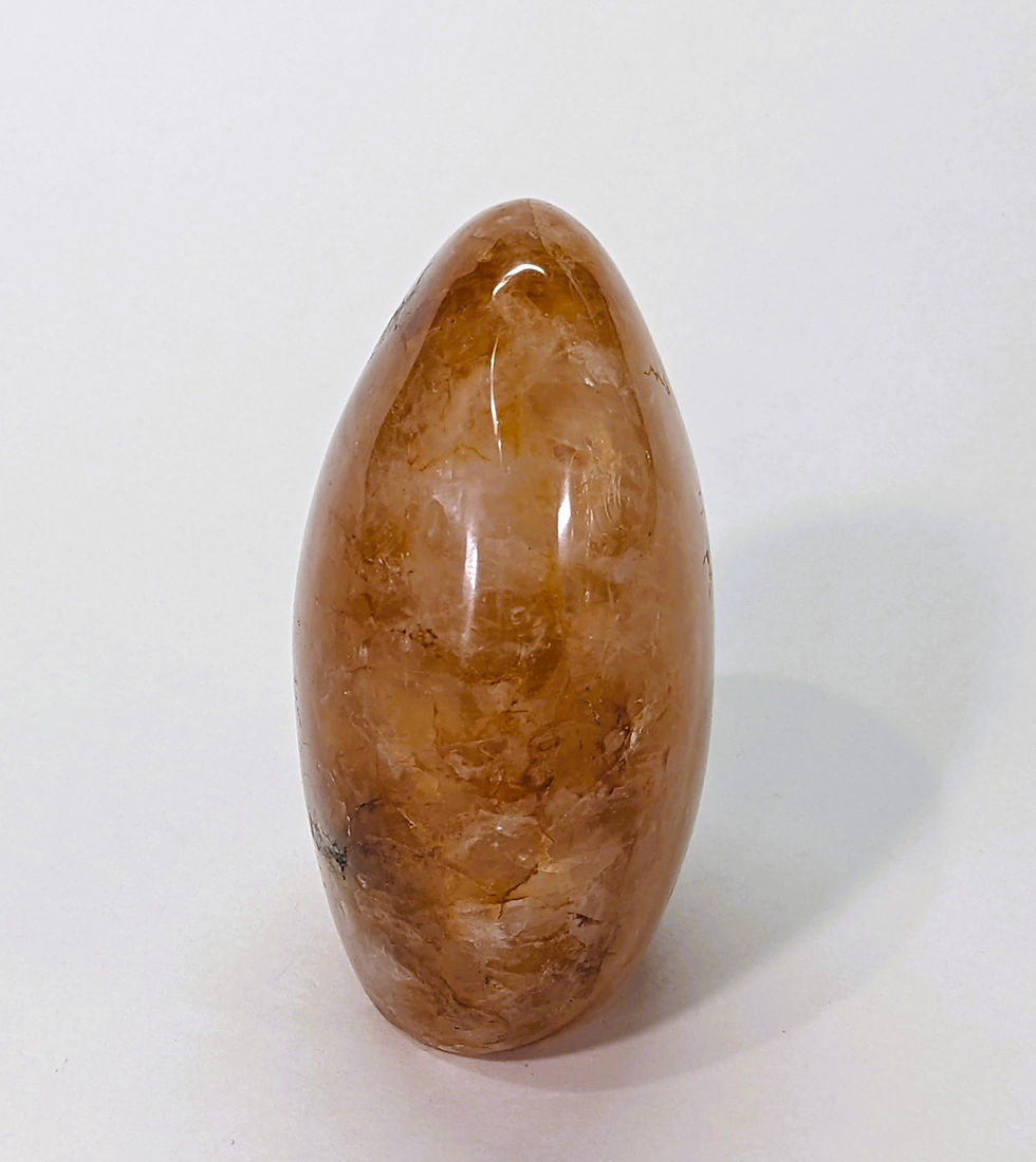 Thumbnail: natural golden healer quartz point with iron oxide inclusions