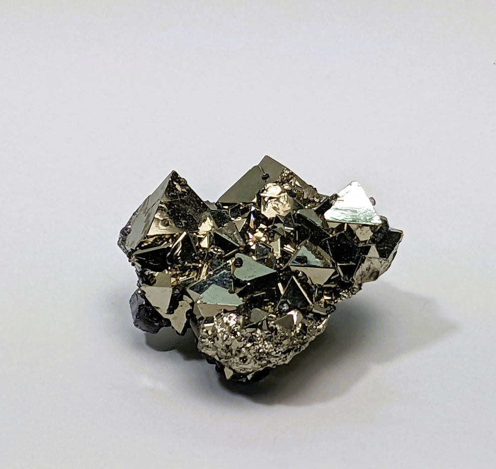 Thumbnail: Metallic Octahedral Pyrite with triangular faces