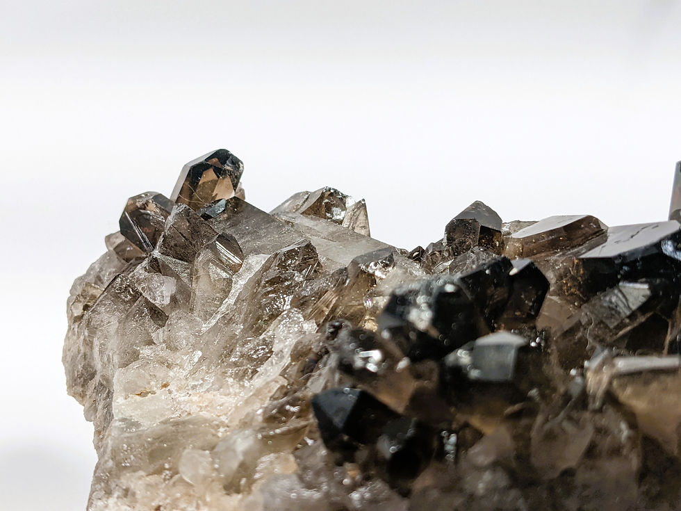 Thumbnail: dark and moody smoky quartz cluster