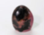 Rhodonite freeform with pink and black veining for emotional balance.