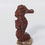 Thumbnail: Miniature soapstone seahorse carving, symbolizing grace, resilience, and emotional strength.