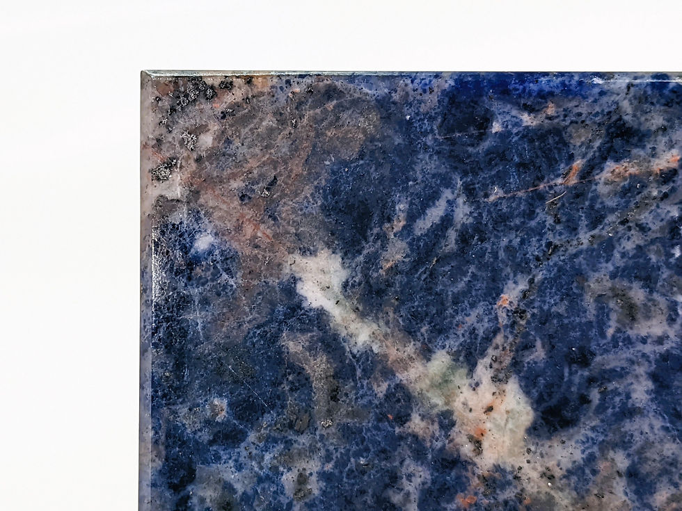 Thumbnail: Polished Sodalite cube and plate set highlighting bold blue color with natural veining detail.