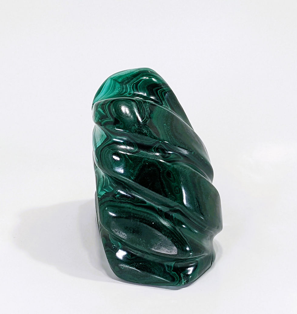 Thumbnail: Polished malachite freeform highlighting smooth, glossy textures with vivid green marbling and natural striations.