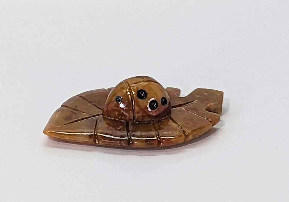 Thumbnail: Hand-carved soapstone ladybug resting on a leaf, symbolizing good luck, happiness, and natural charm.