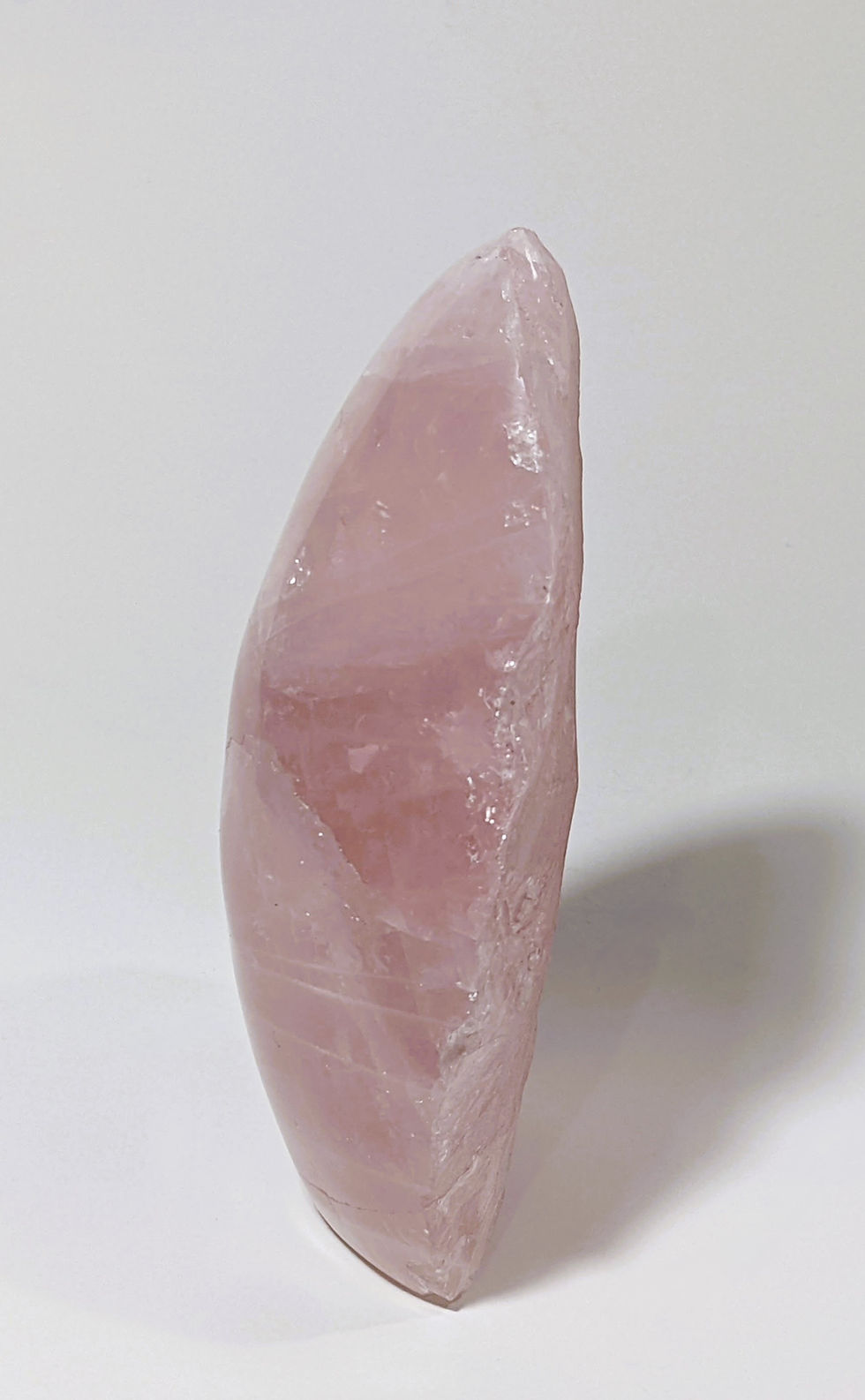 Thumbnail: Polished and raw Rose Quartz crystal showing soft pink hues and natural textures