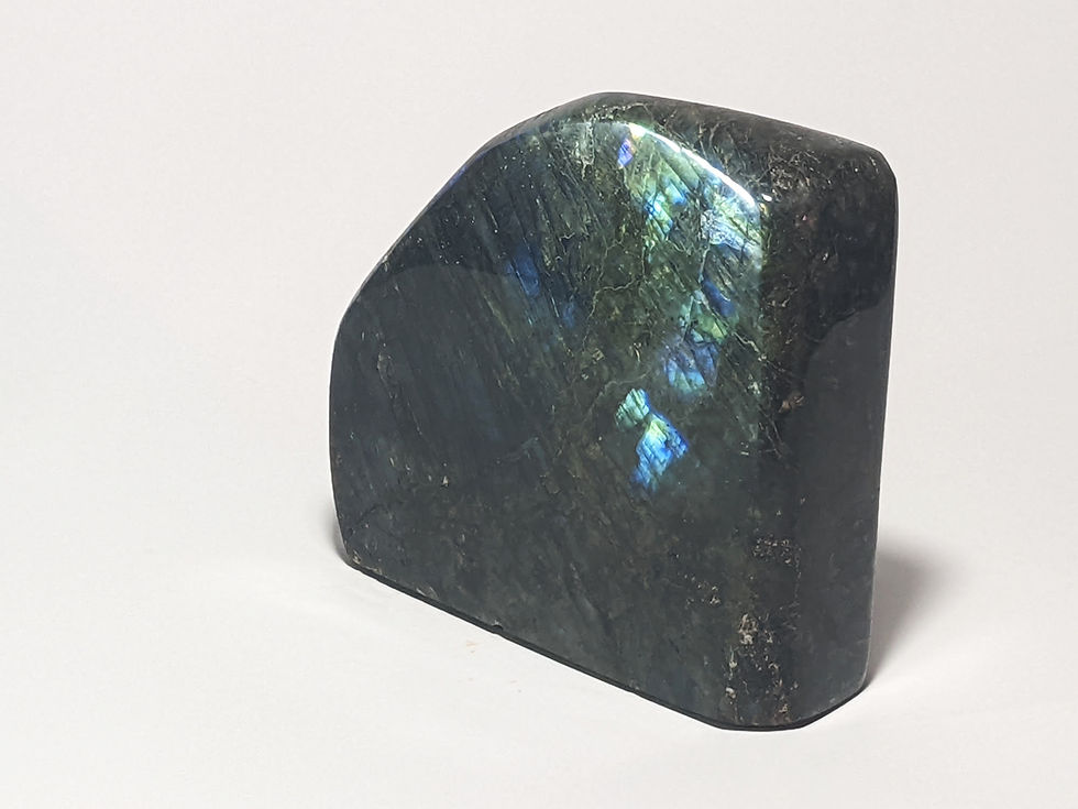 Thumbnail: Labradorite stone with iridescent flashes of blue, green, and gold, known for its mystical energy, promoting intuition