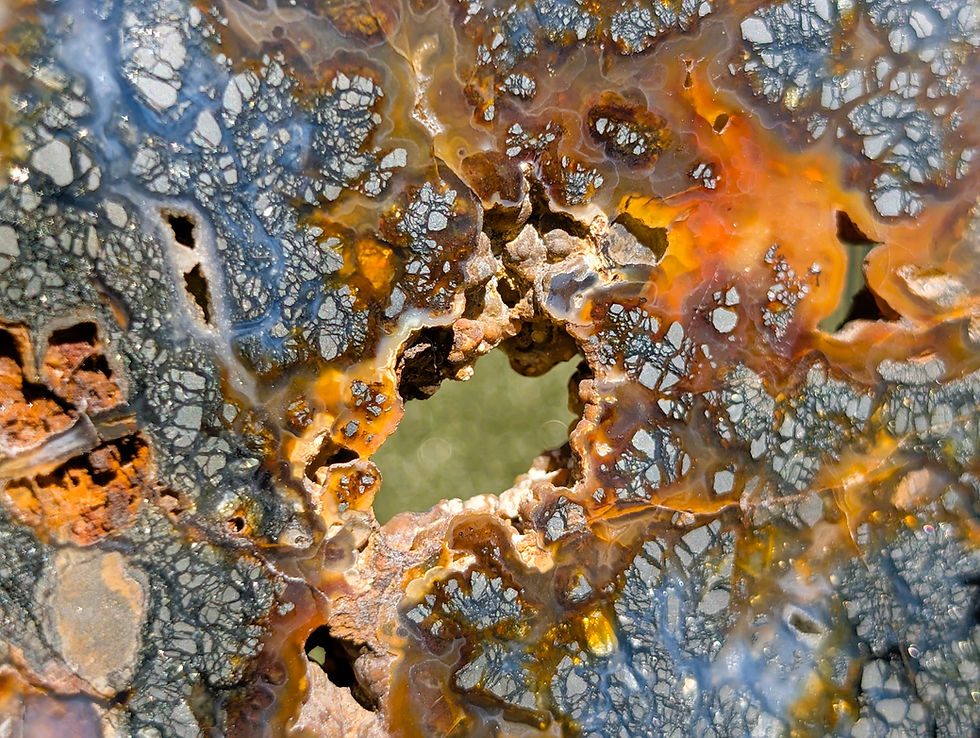 plume marcasite agate slice showing branching metallic inclusions