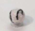 Zebra Jasper with bold black and white stripes, known for its grounding properties and ability to promote emotional balance
