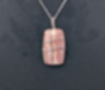 Rhodochrosite pendant with pink color and natural banding patterns