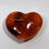 Thumbnail: Carnelian Heart with vibrant orange-red hues, known for its energizing and motivating properties. At jujujems.
