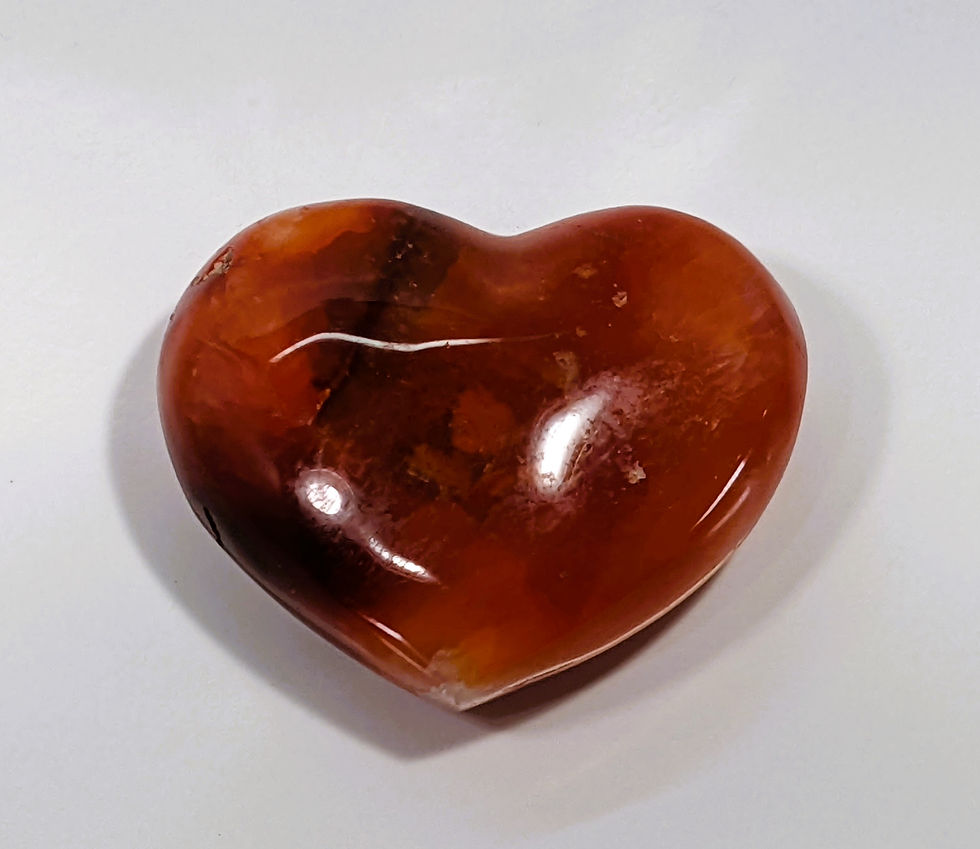Thumbnail: Carnelian Heart with vibrant orange-red hues, known for its energizing and motivating properties. At jujujems.