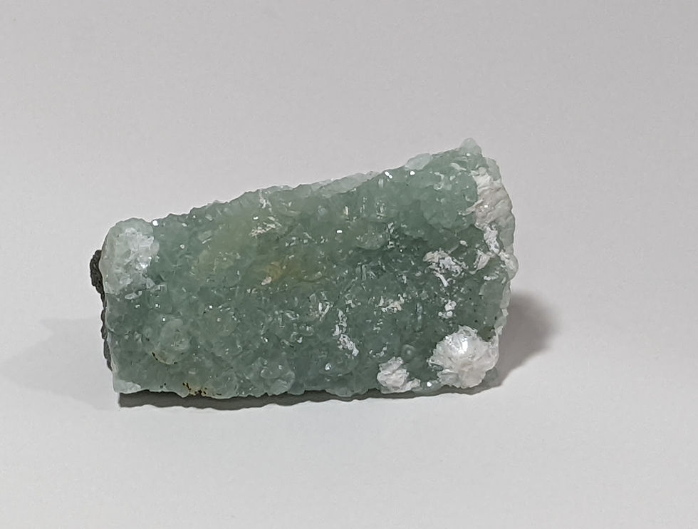 Thumbnail: Rough Prehnite mineral with pale green translucent surfaces