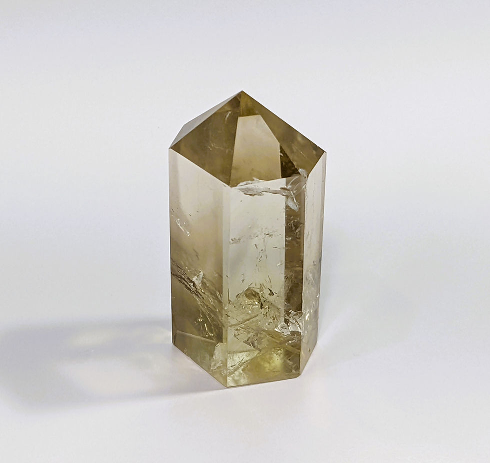 Thumbnail: Smoky Citrine with a blend of smoky brown and golden hues, known for grounding and abundance-attracting properties. jujujems